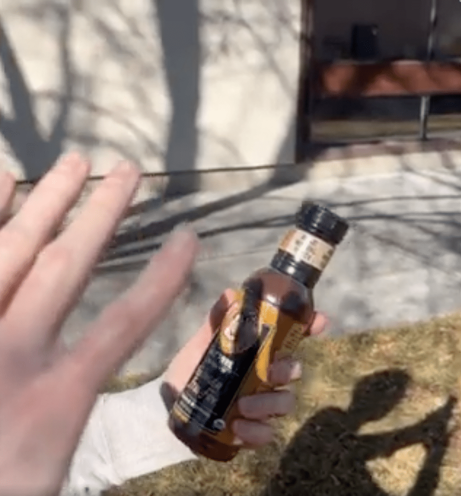 Hand casting shadow over product logo to prove physical branding